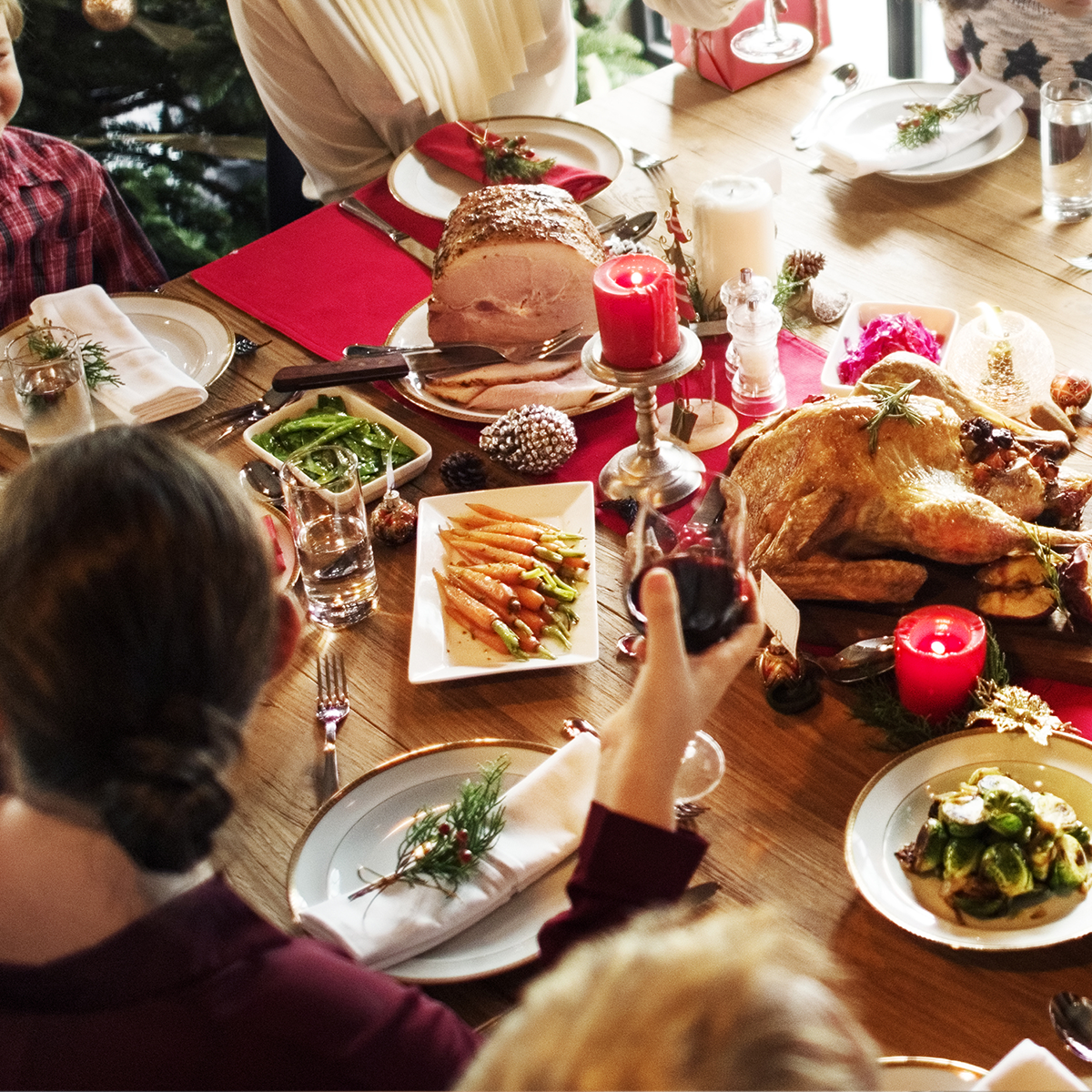 A family sitting around a dinner table for a holiday meal